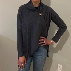 Soft and cozy open cardigan with button closure.